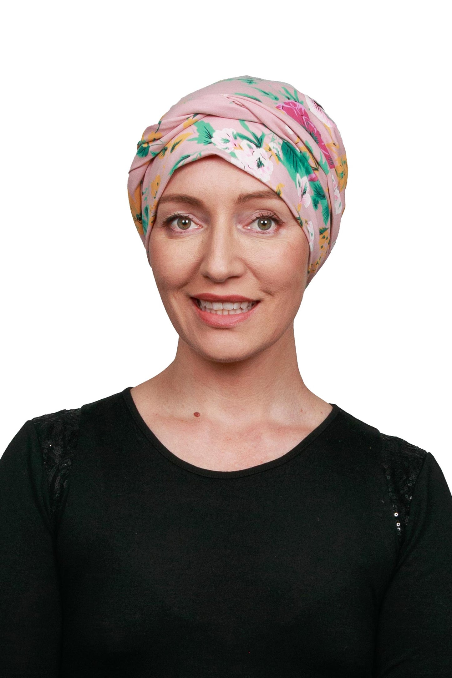 Women wearing a pink and floral cancer head wrap scarf for cancer