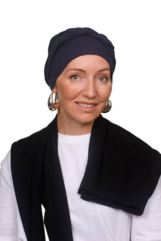 Women wearing an ink cotton cancer hat as a headscarf and head covering