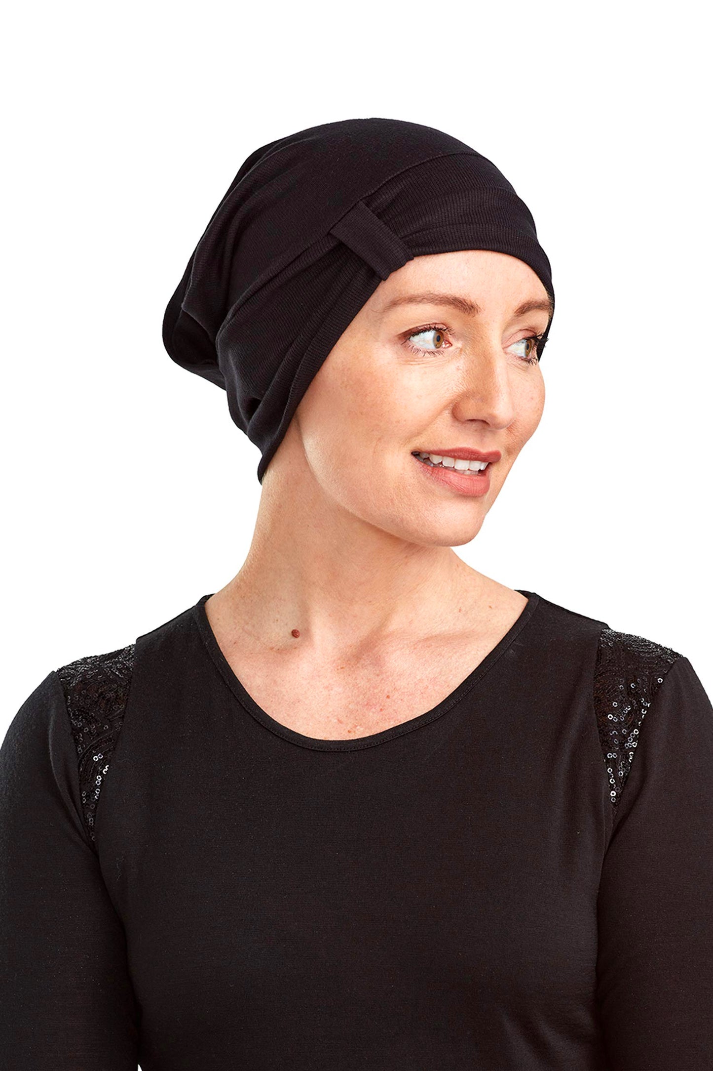 Women wearing a cancer beanie as a head covering