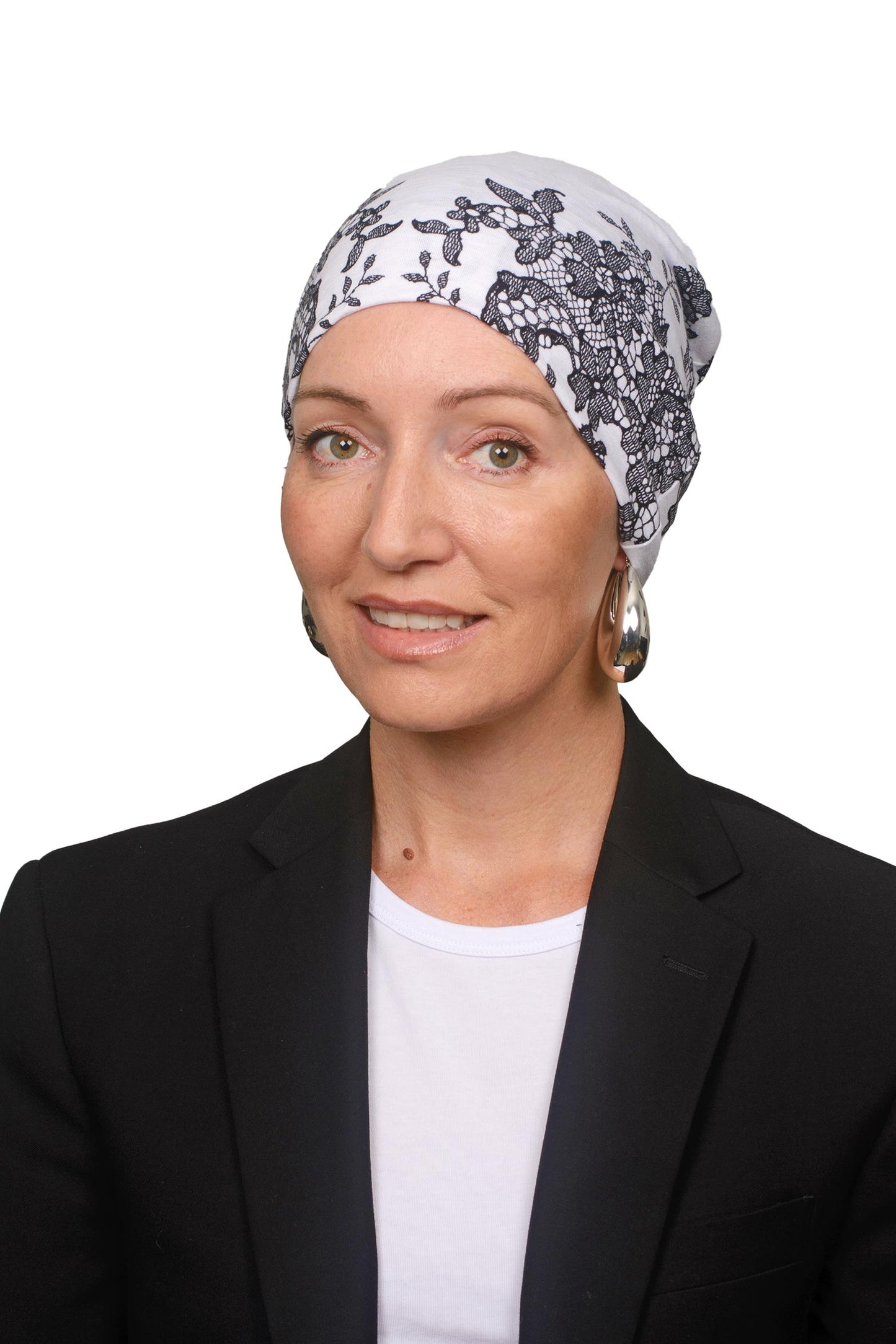 Women wearing a cancer nightcap in a lace print as a headcovering