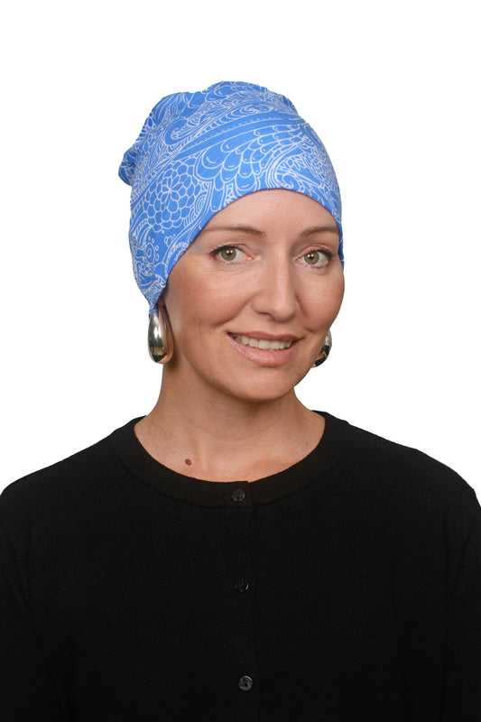 Women wearing a blue and white nightcap for cancer as a headcovering