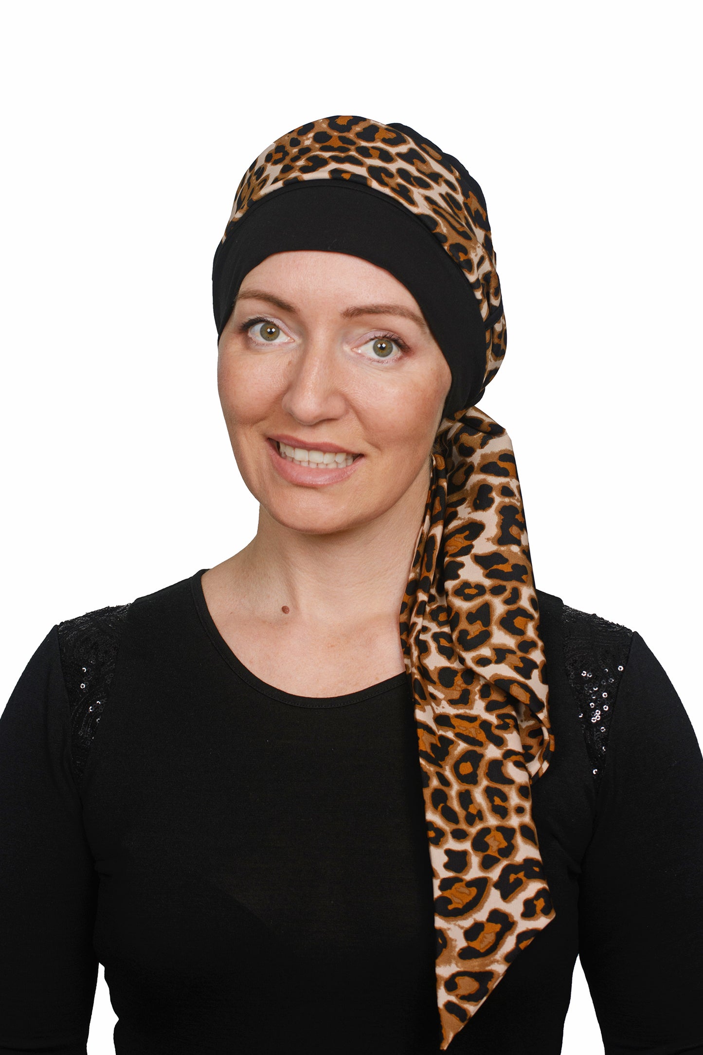 Woman wearing a black head cap with a leopard print scarf on a white background