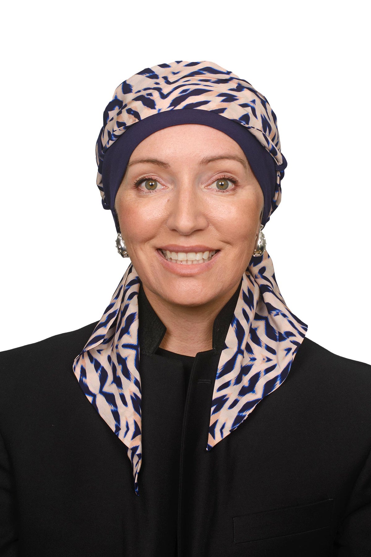Women wearing an ink cap with a head scarf in a modern animal print for hair loss