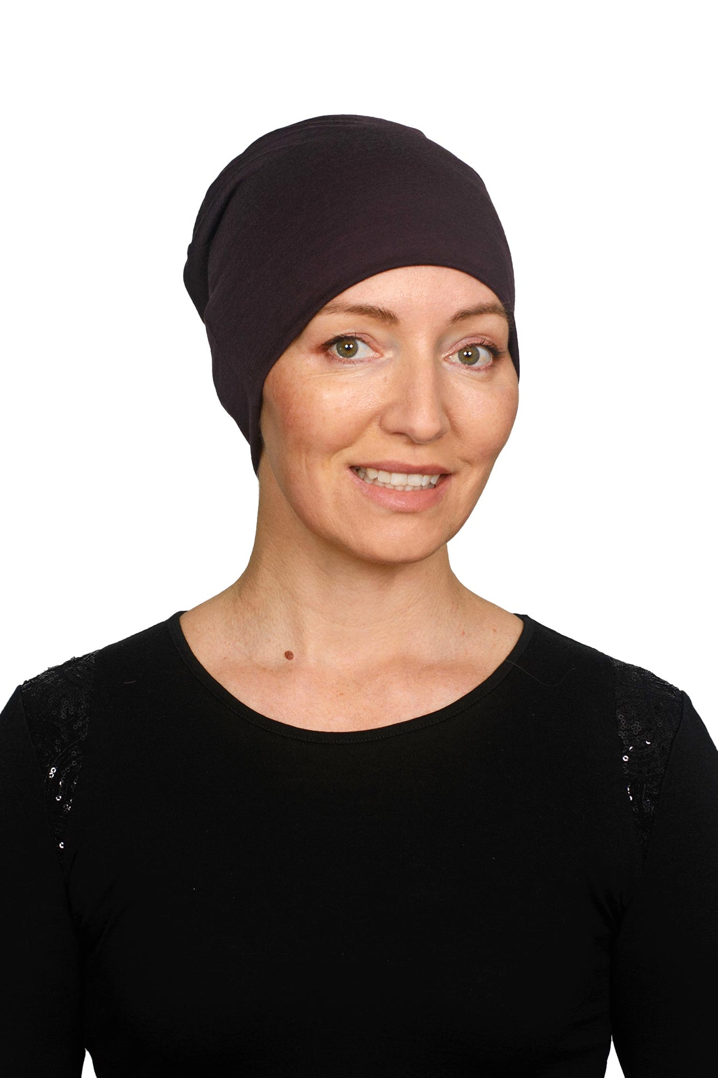 Women wearing a cancer hat in a dark purple as a head covering.