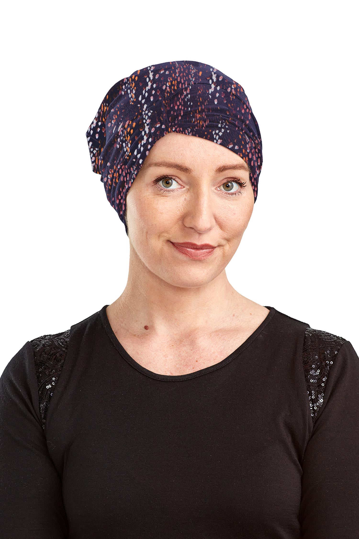 Woman wearing a patterned headscarf on a white background