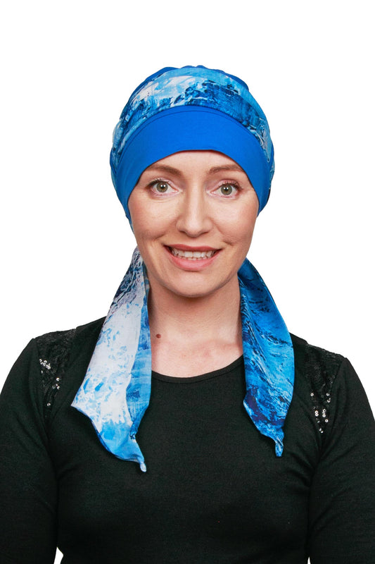 Women Wearing a Cancer Scarf Cap with a blue scarf as a headwrap