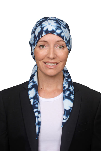 Women wearing a headwrap for cancer in ink and blue as a head covering