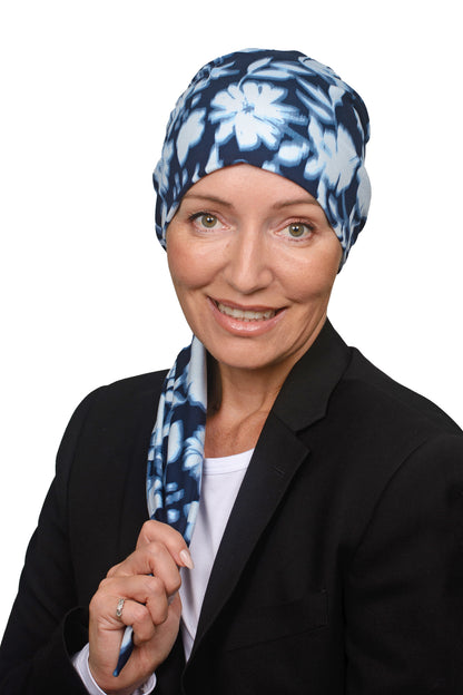 Women wearing a headwrap for cancer in ink and blue as a head covering