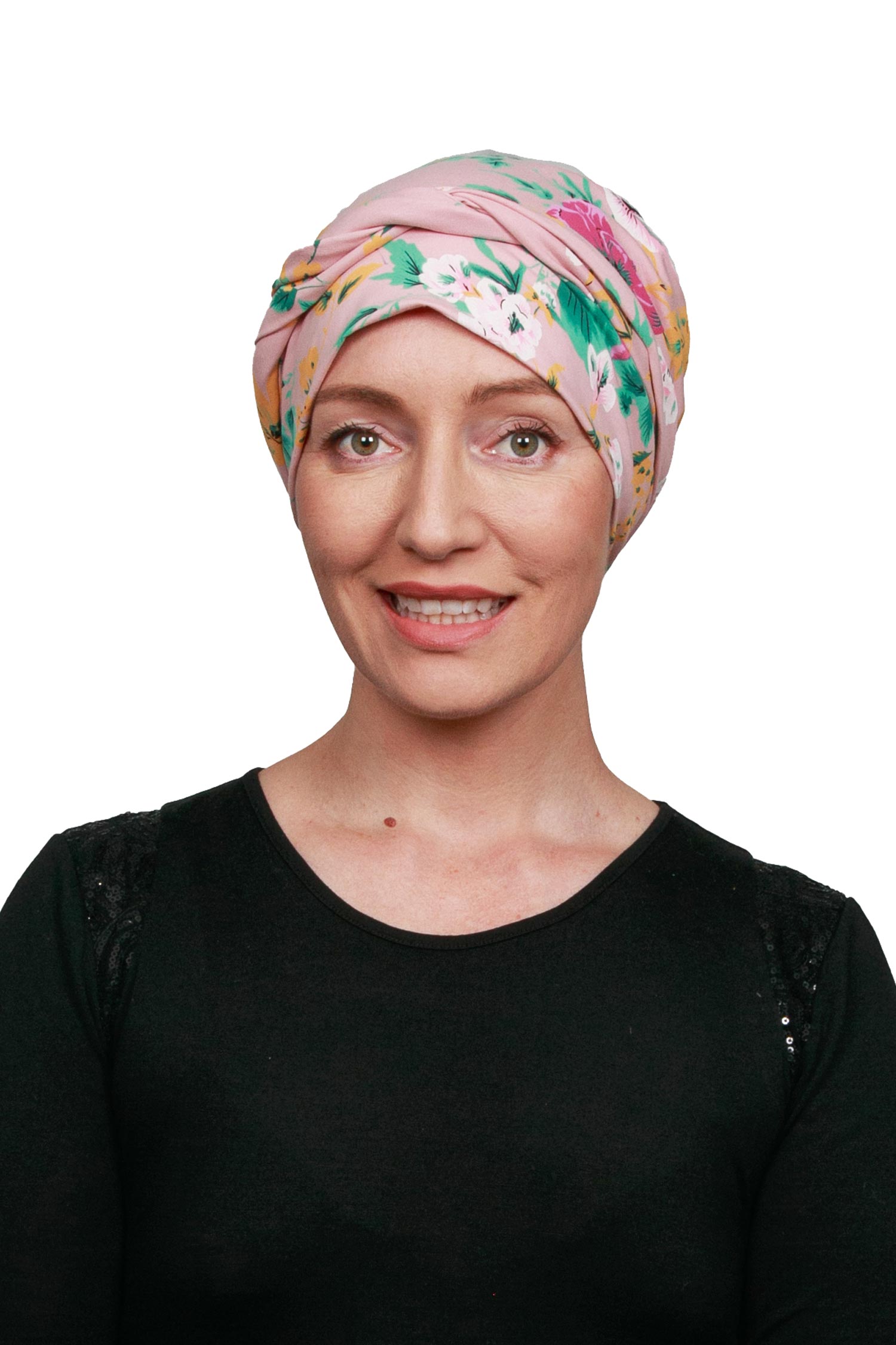 Women wearing a pink and floral cancer head wrap scarf for cancer