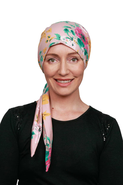 Women wearing a pink and floral cancer head wrap scarf for cancer