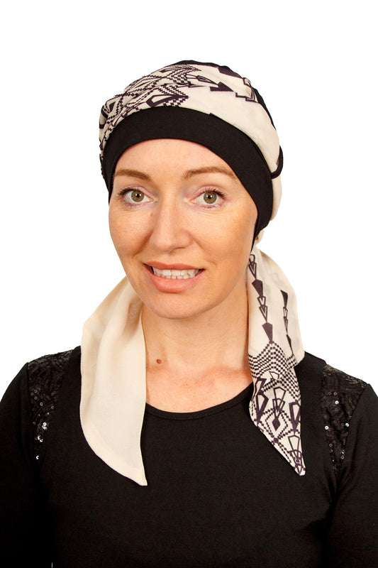 Women Wearing a cancer cap with a scarf attached as a head covering in black in NZ