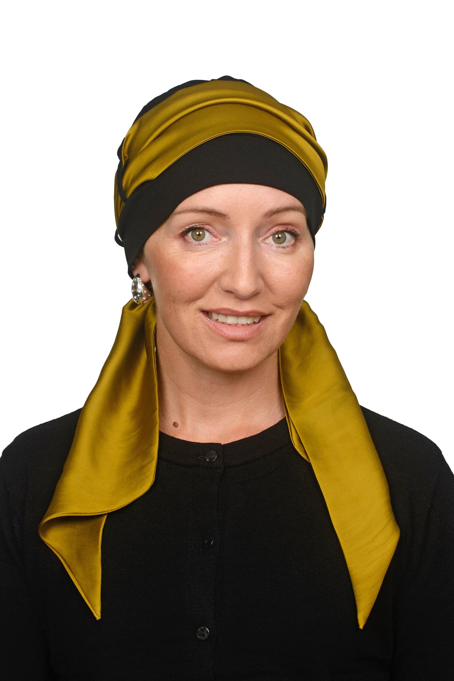 Women wearing a cap and gold scarf for cancer as a head covering