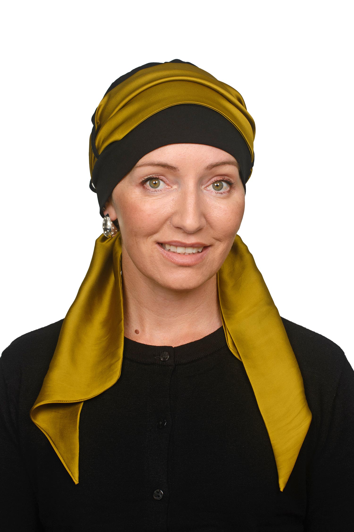 Women wearing a cap and gold scarf for cancer as a head covering