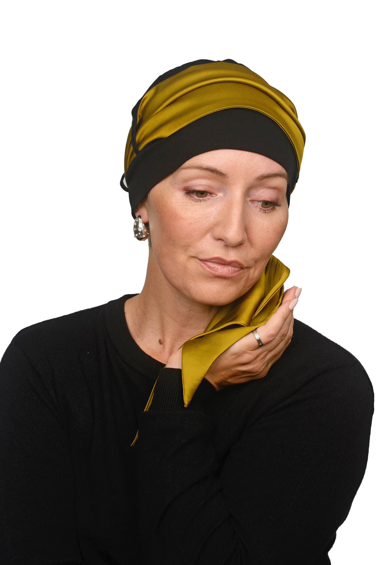 Women wearing a cap and gold scarf for cancer as a head covering