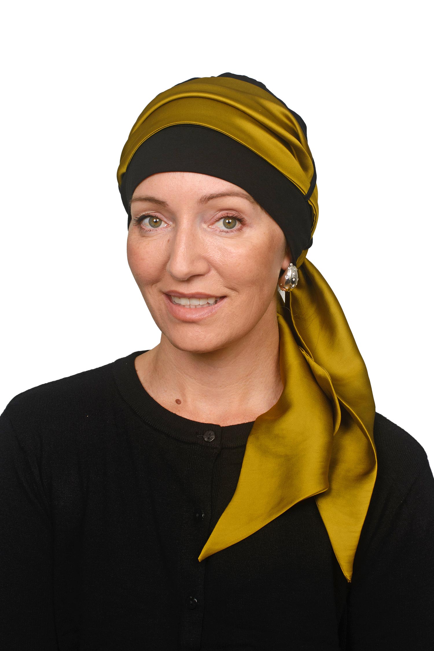 Women wearing a cap and gold scarf for cancer as a head covering