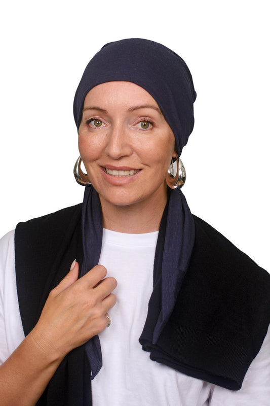 Women wearing an ink cotton cancer hat as a headscarf and head covering