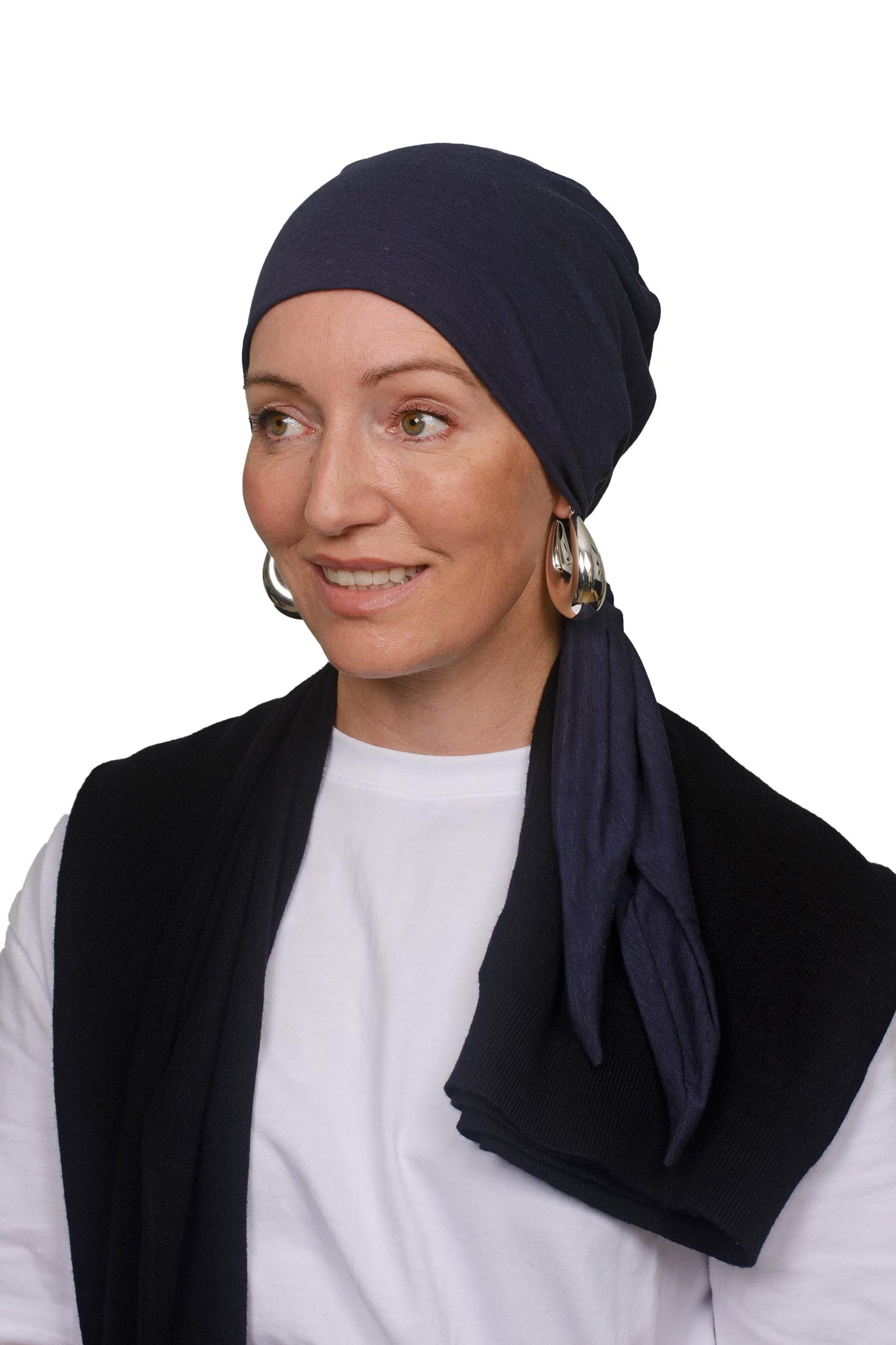Women wearing an ink cotton cancer hat as a headscarf and head covering