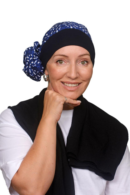 Women wearing a headscarf hat in blues and white with an ink band as a headcovering for hair loss