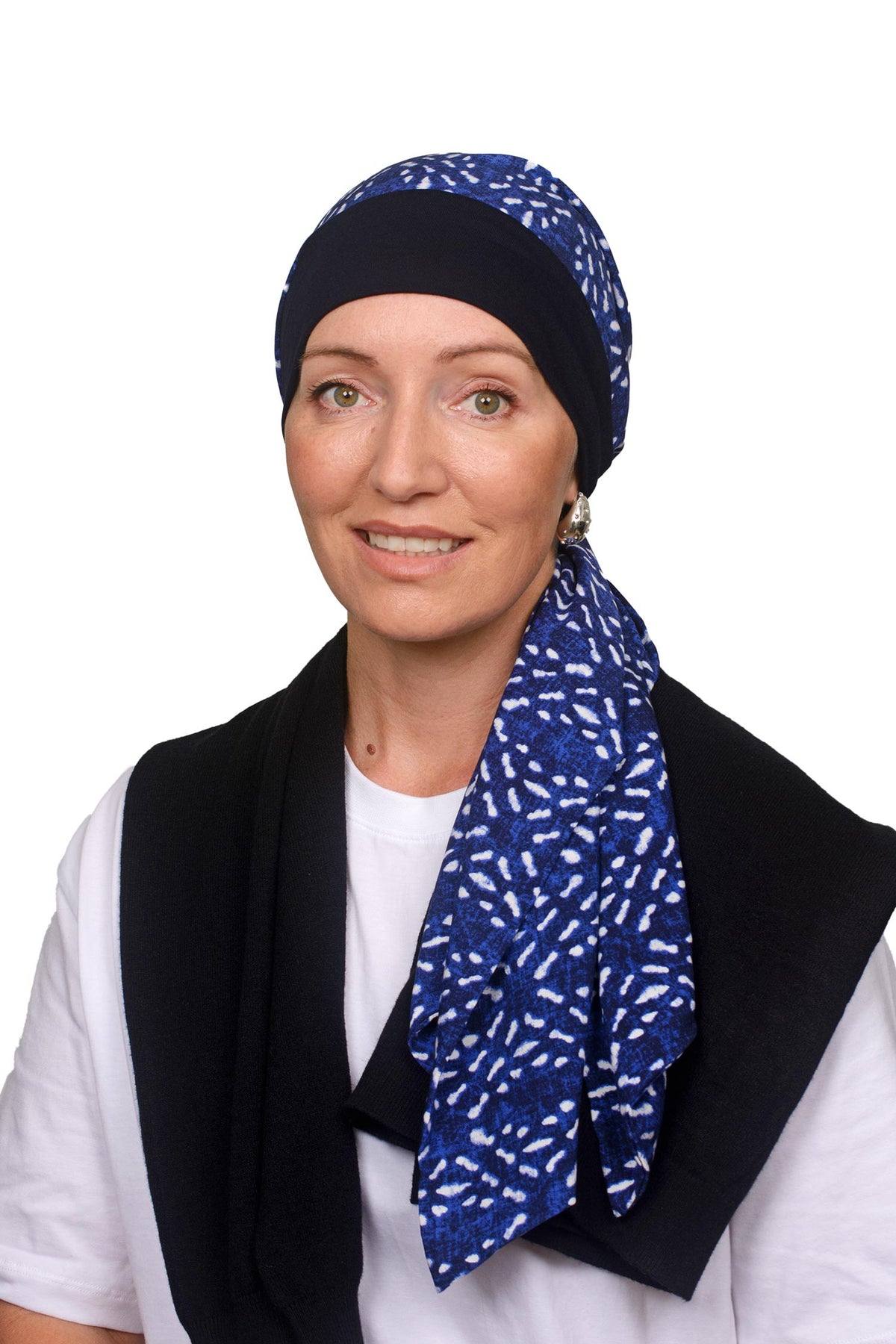 Women wearing a headscarf hat in blues and white with an ink band as a headcovering for hair loss