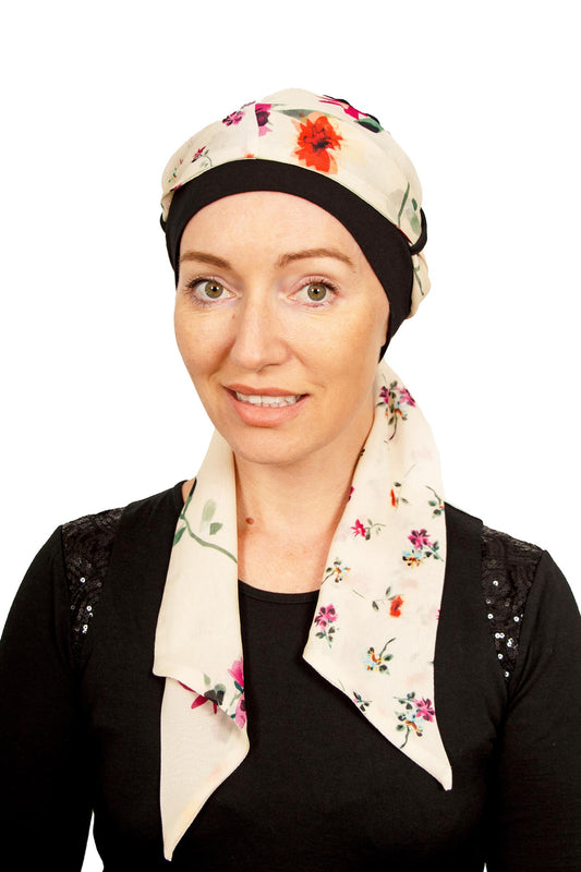 Women Wearing a cancer cap with a scarf attached as a head covering in black in NZ