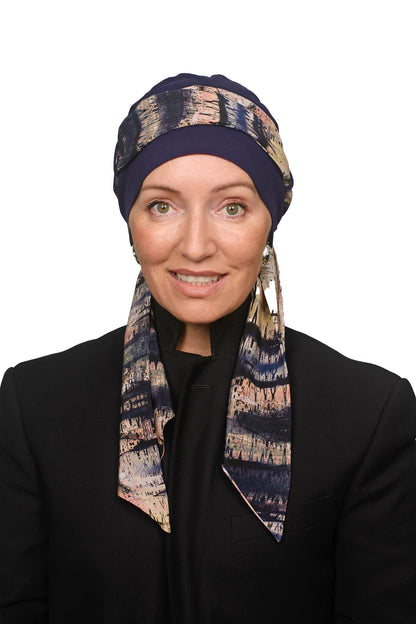 Women wearing a cancer scarf and cap as a headcovering