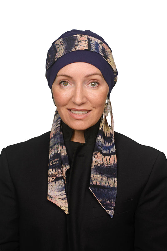 Women wearing a cancer scarf and cap as a headcovering