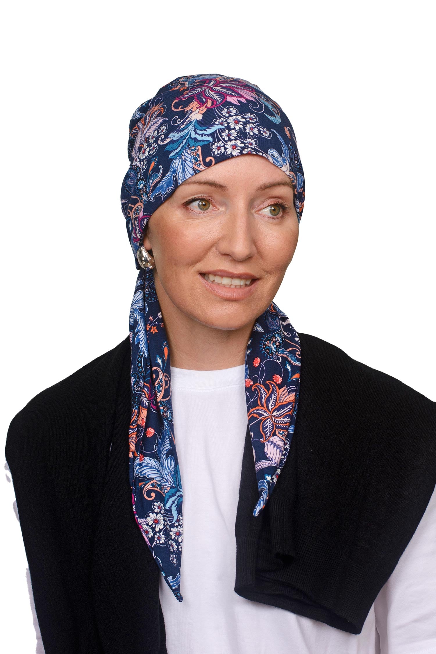 Women wearing a paisley and ink wrap hat as a head covering for cancer