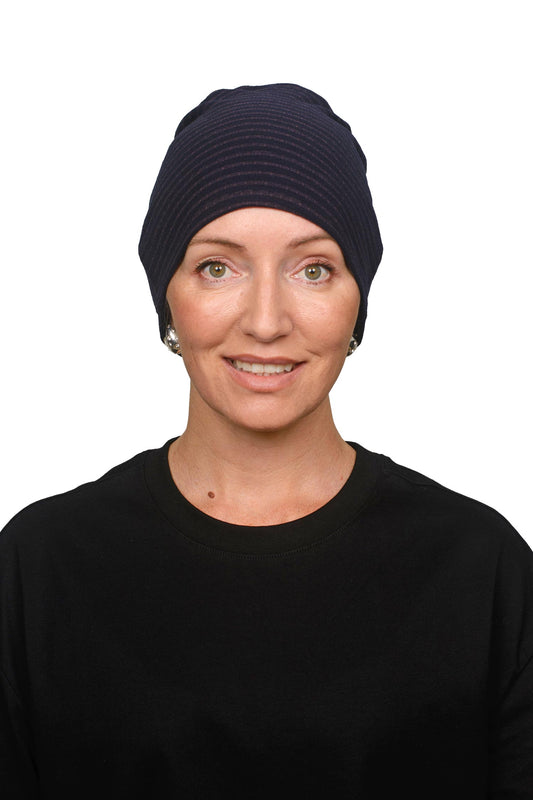 women wearing a stripe merino nightcap as a headcovering for cancer
