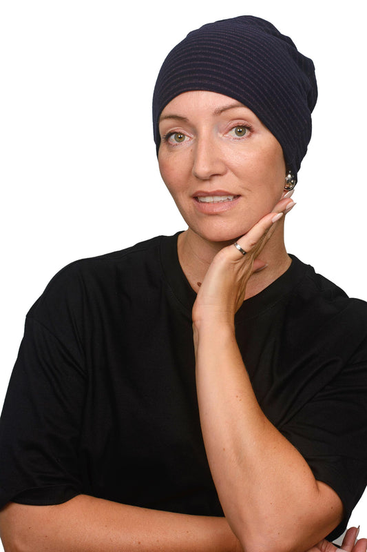 women wearing a stripe merino nightcap as a headcovering for cancer