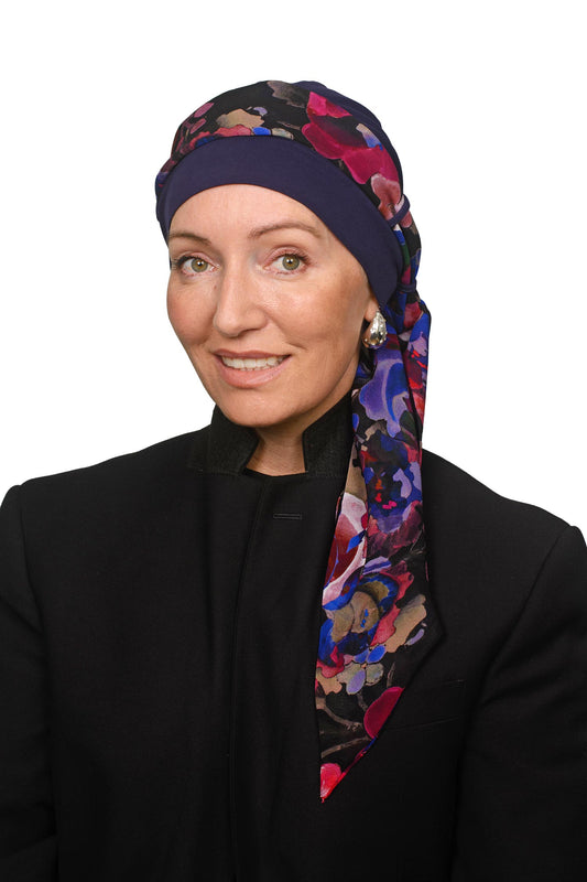 Women wearing a cancer hat as a headscarf in ink with a colourful floral scarf
