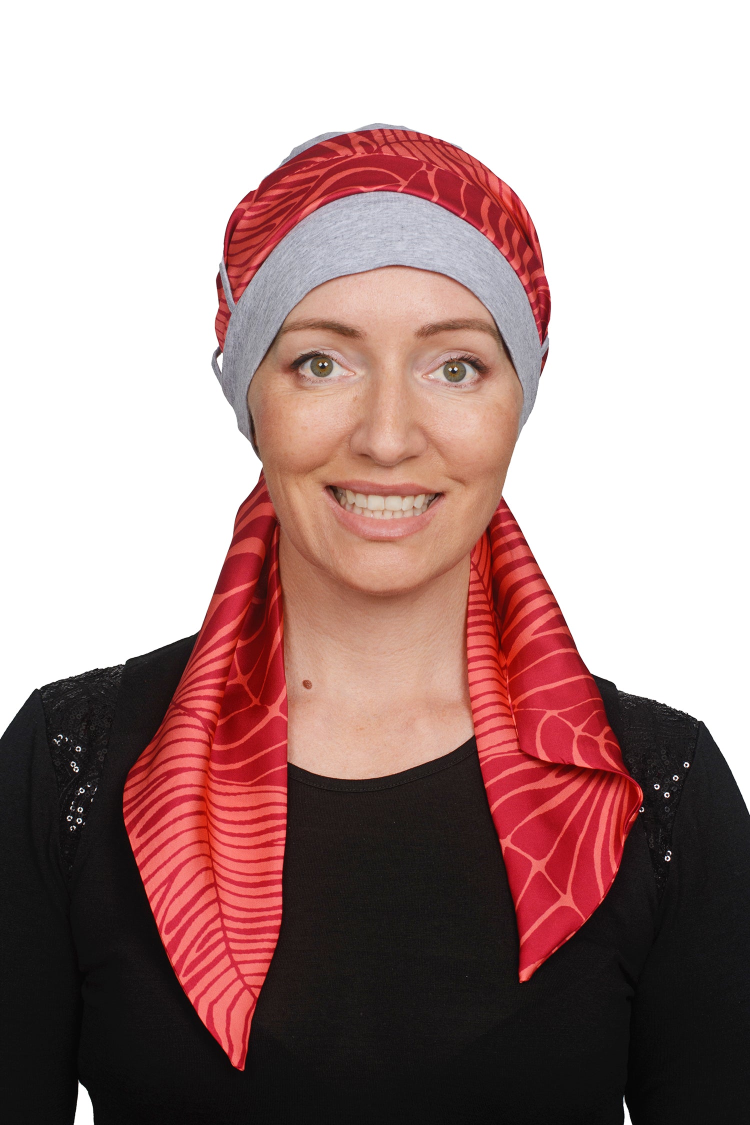 Women wearing a cancer hat in grey marle with a coloured scarf as a head covering
