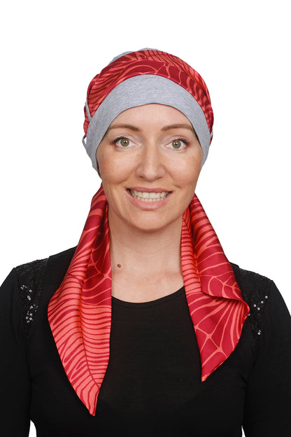 Women wearing a cancer hat in grey marle with a coloured scarf as a head covering
