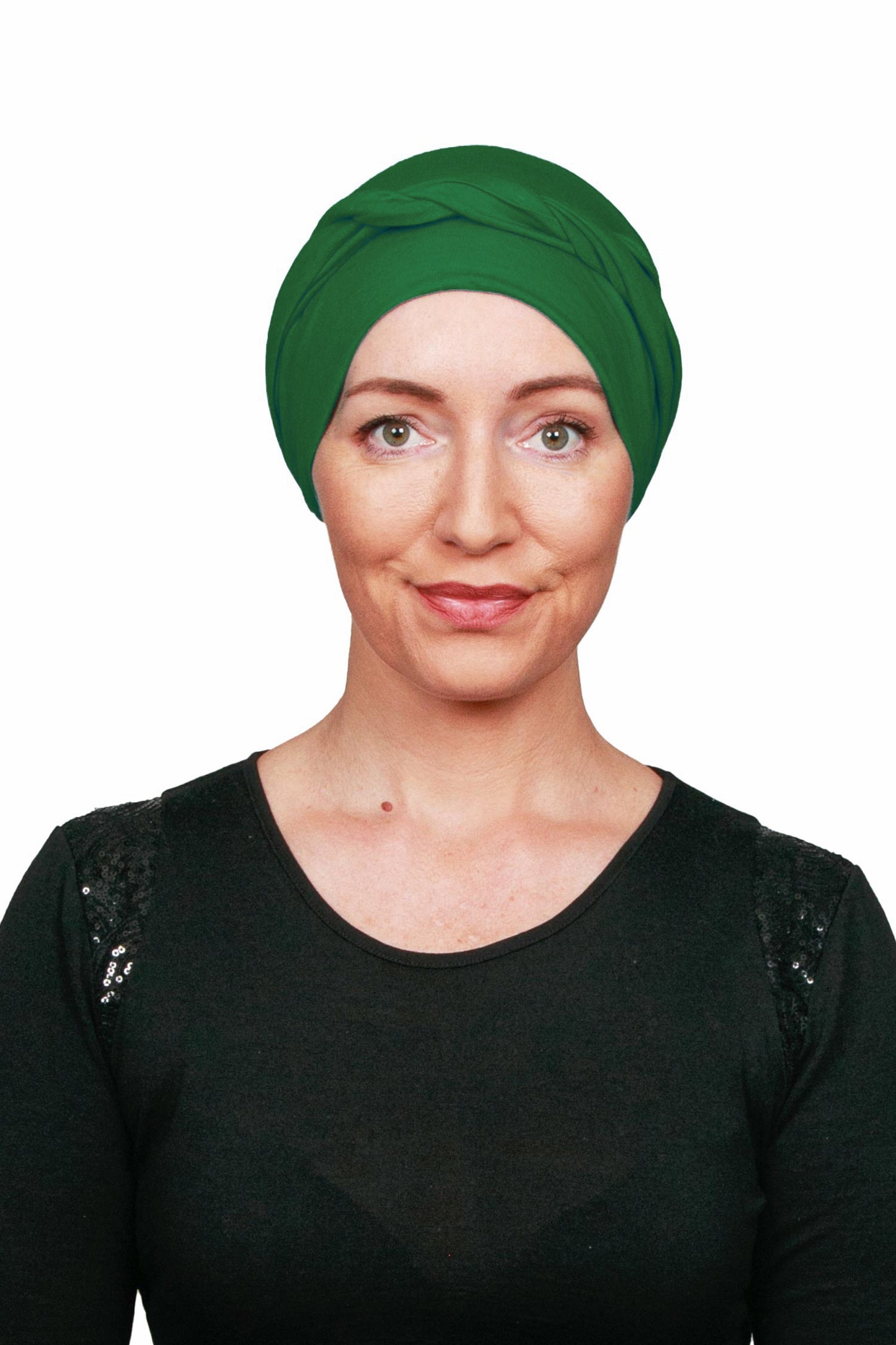 Woman wearing a green headscarf on a white background