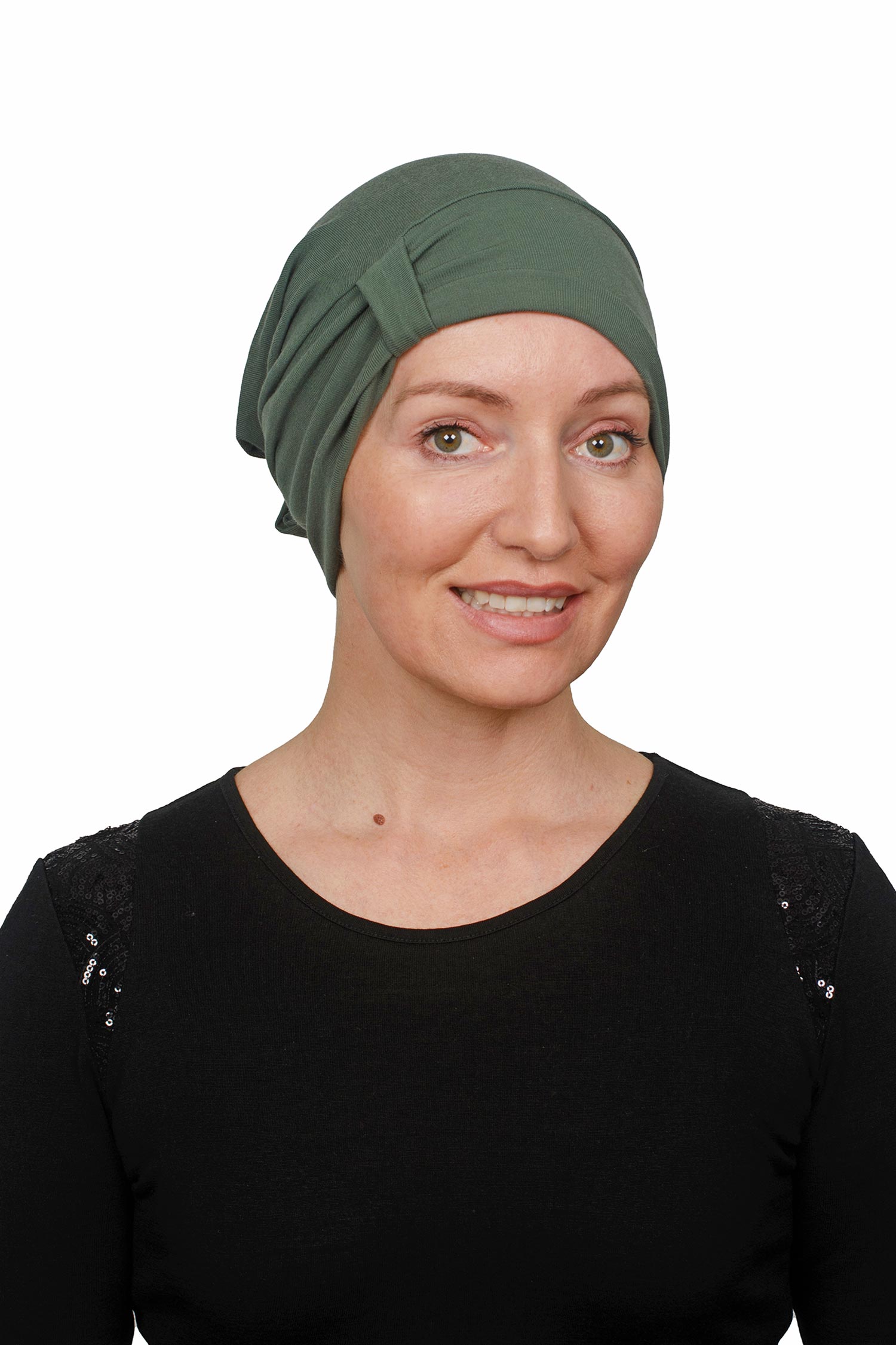 Woman wearing a green headscarf on a white background