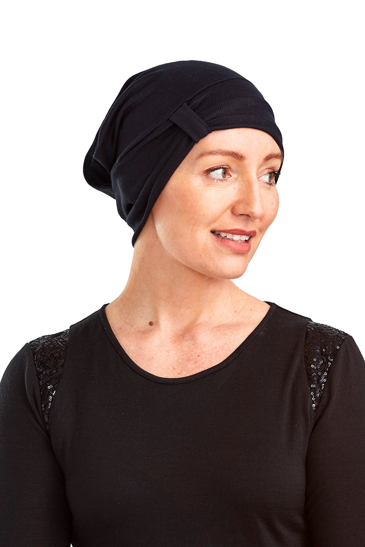 Women wearing a cancer beanie as a head covering