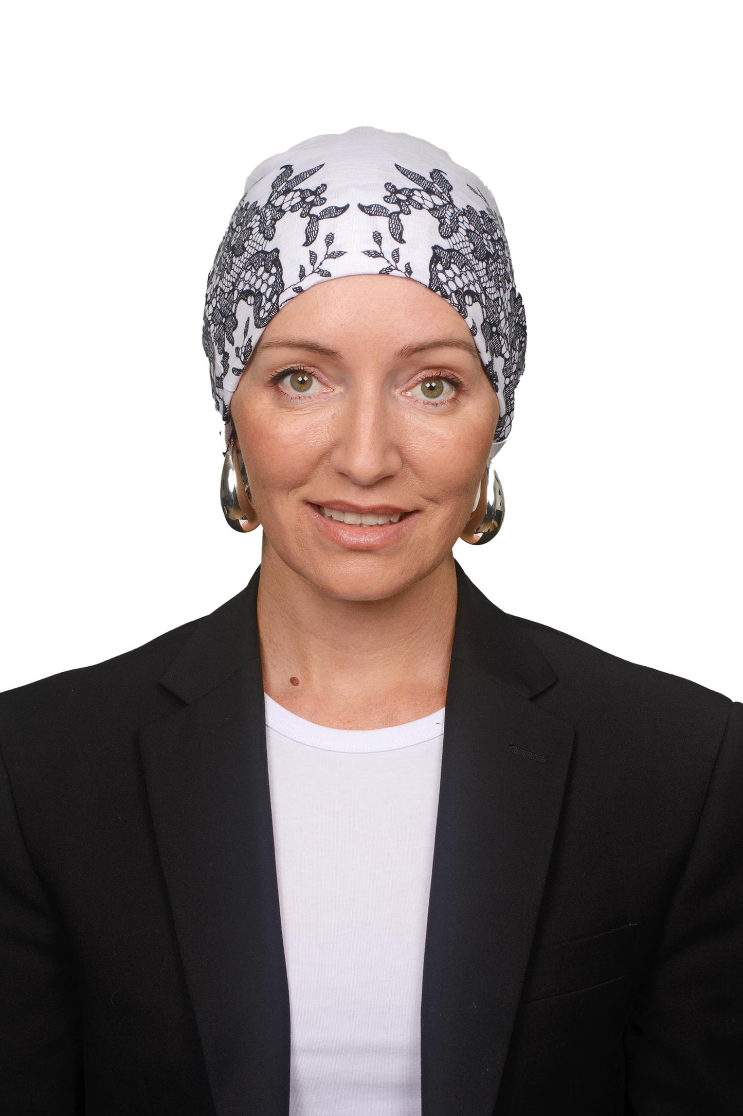 Women wearing a cancer nightcap in a lace print as a headcovering
