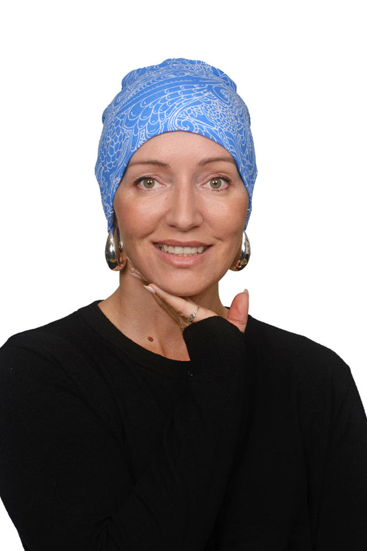 Women wearing a blue and white nightcap for cancer as a headcovering