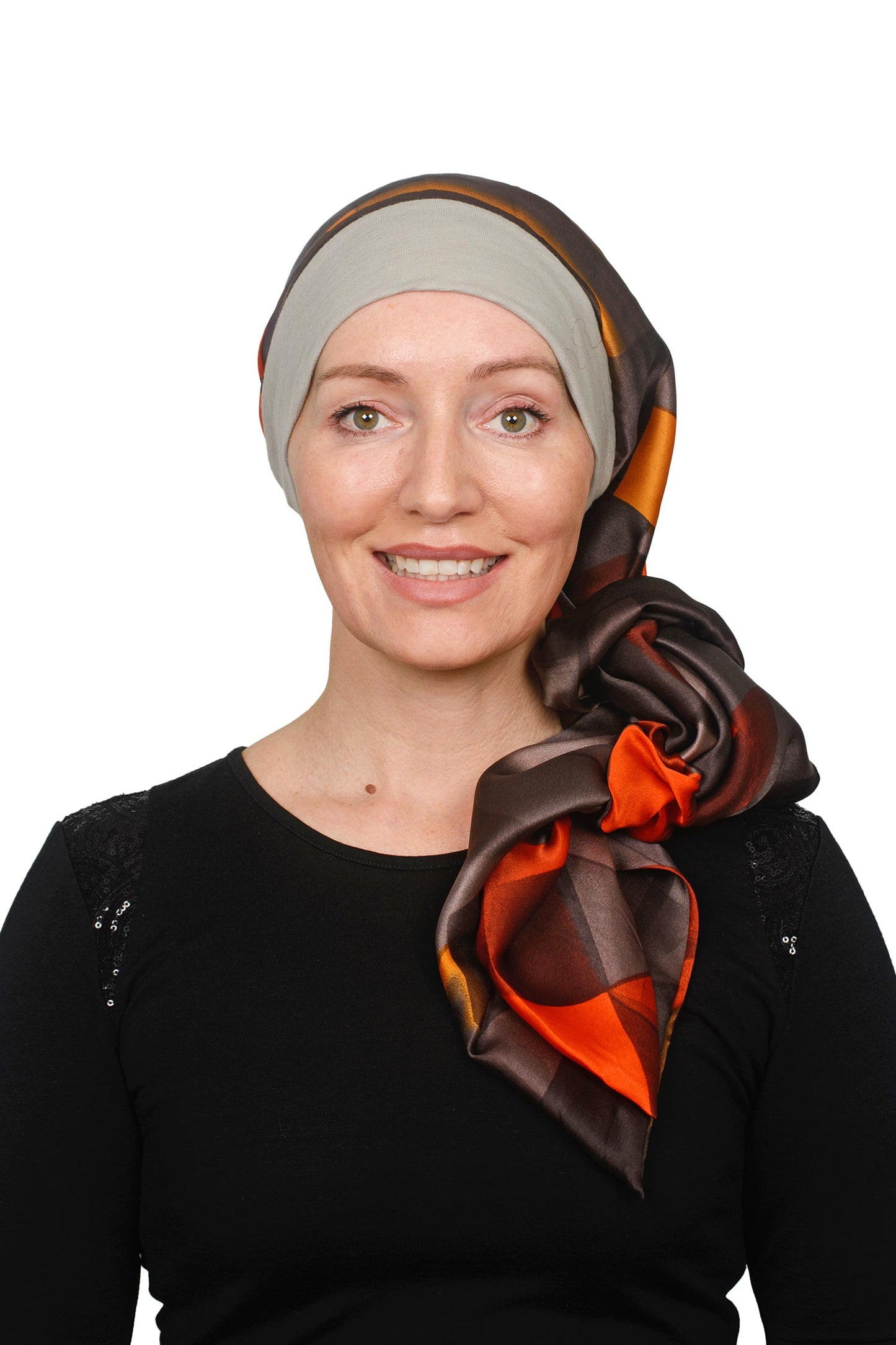 Women Wearing a Sand coloured band cancer scarf hat with a silky brown coloured scarf headcovering