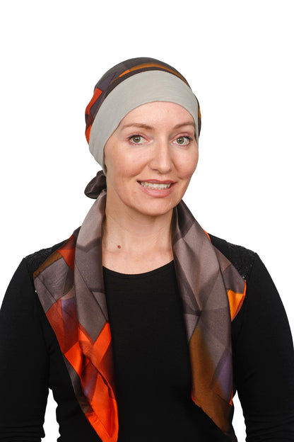 Women Wearing a Sand coloured band cancer scarf hat with a silky brown coloured scarf headcovering