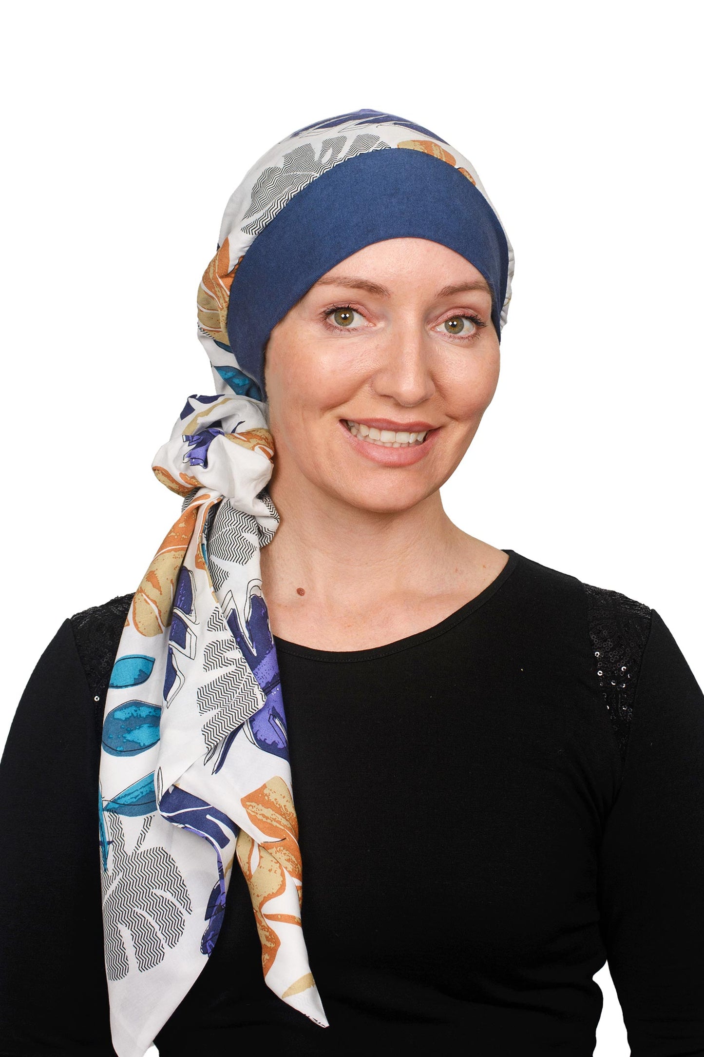 Women Wearing a cancer scarf hat with a scrunchie