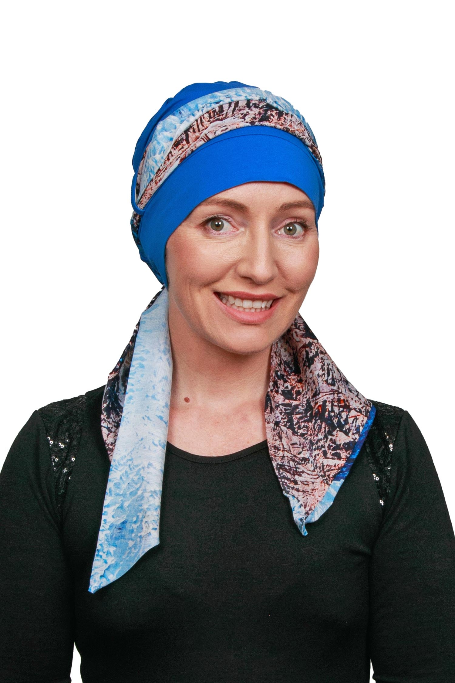 Women Wearing a Cancer cap with a scarf threaded through it as a headwrap.