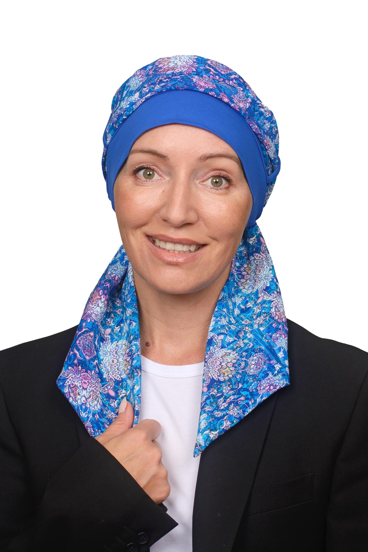 Women wearing a cancer cap with a head scarf in it in blues and paisley print as a head covering