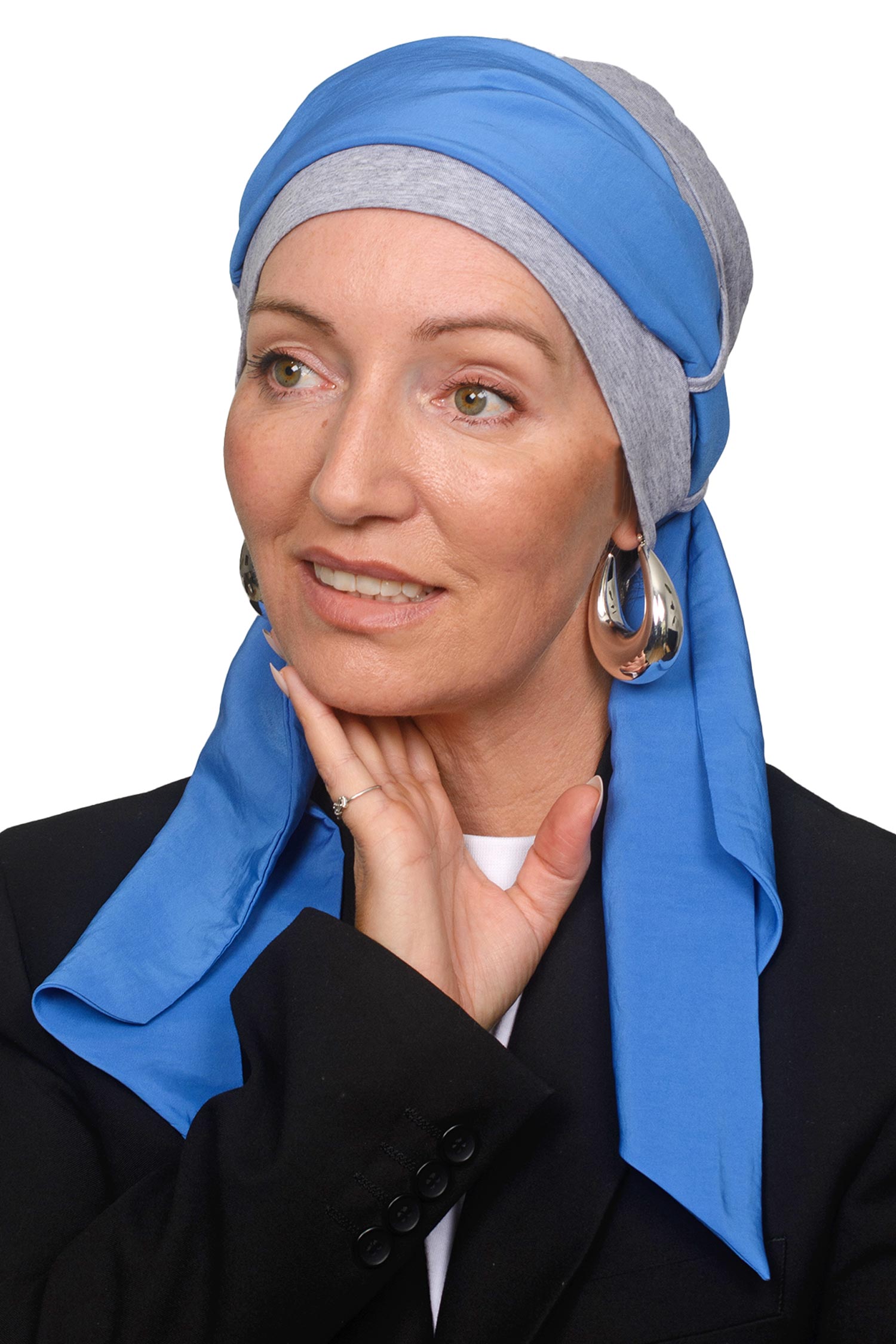 Women wearing a grey silver cap with a blue headscarf in it for cancer as a headcovering1