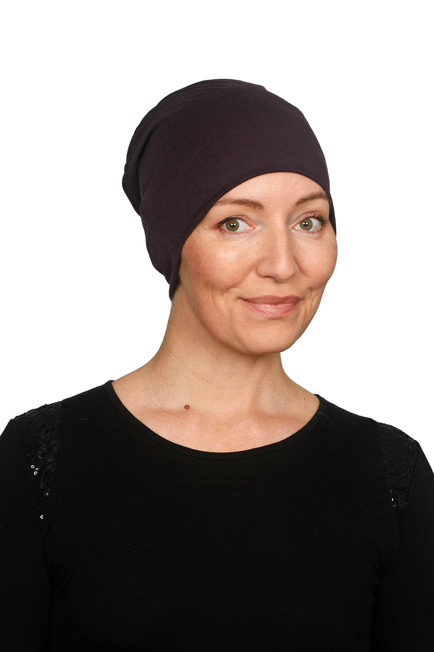 Women wearing a cancer hat in a dark purple as a head covering.