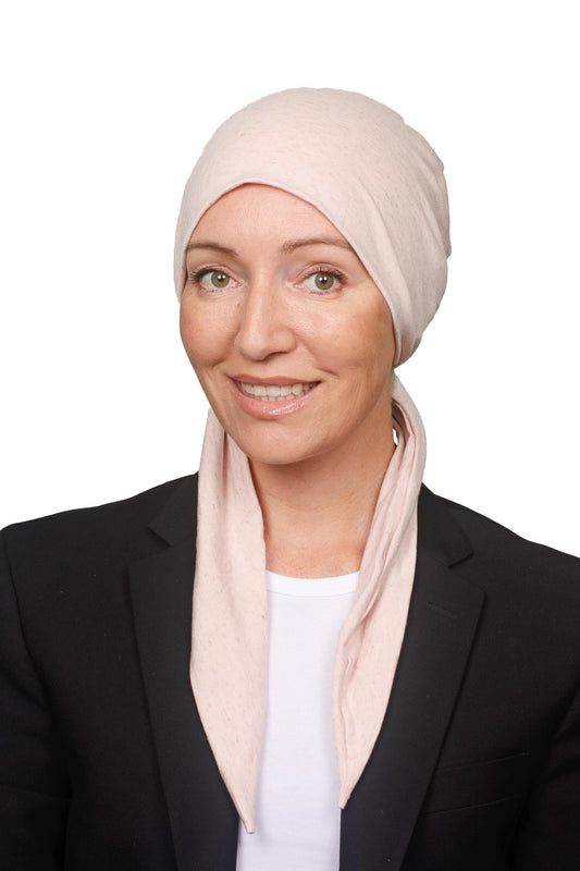 Women wearing a pink linen flax cotton cancer scarf hat as a headwrap