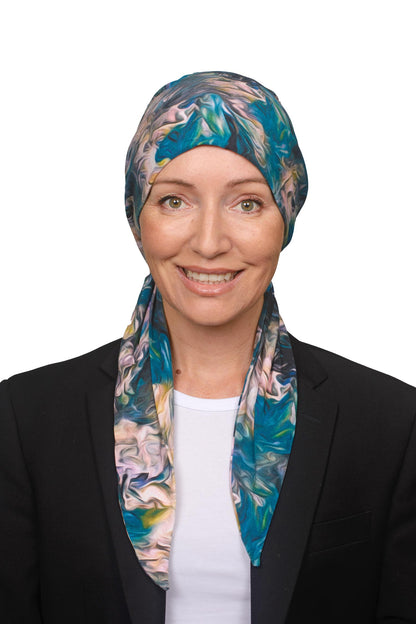 Women wearing a blue and pink swirly cancer head scarf as a head covering for cancer