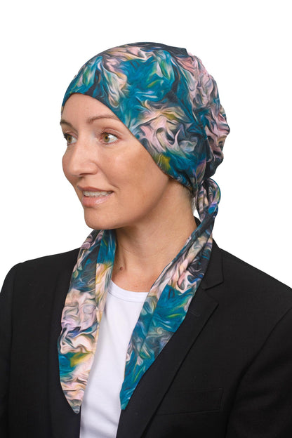 Women wearing a blue and pink swirly cancer head scarf as a head covering for cancer