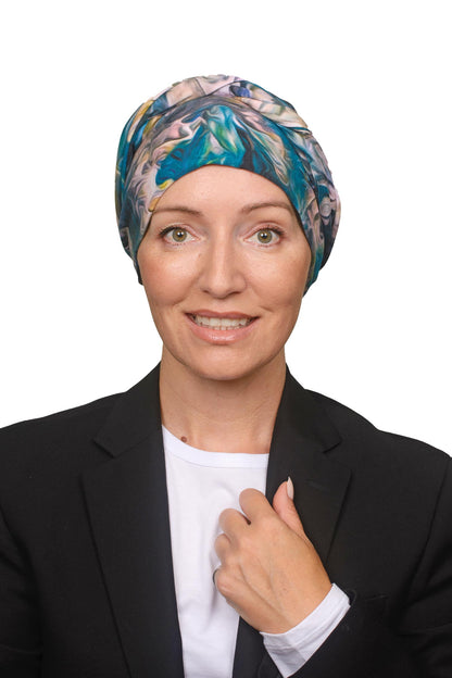 Women wearing a blue and pink swirly cancer head scarf as a head covering for cancer