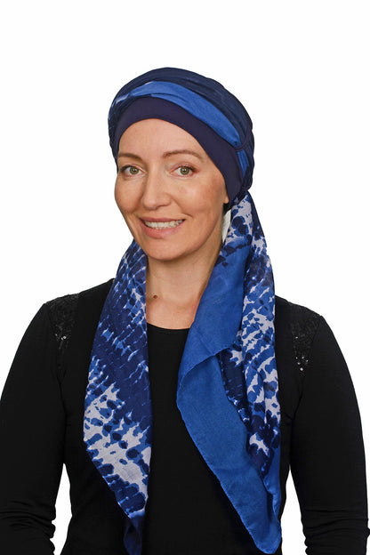 Women wearing a cancer hat with cap and seperate scarf in blue