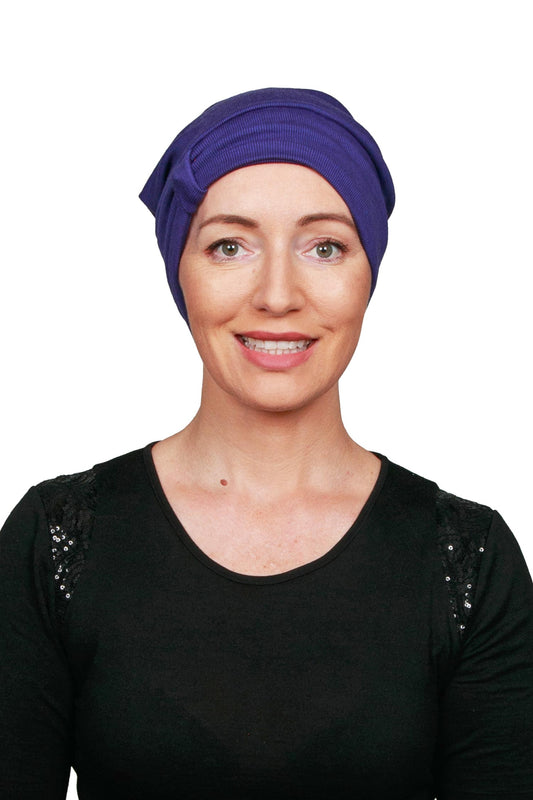 Women Wearing a Purple Cancer Hat Beanie worn as a headcovering